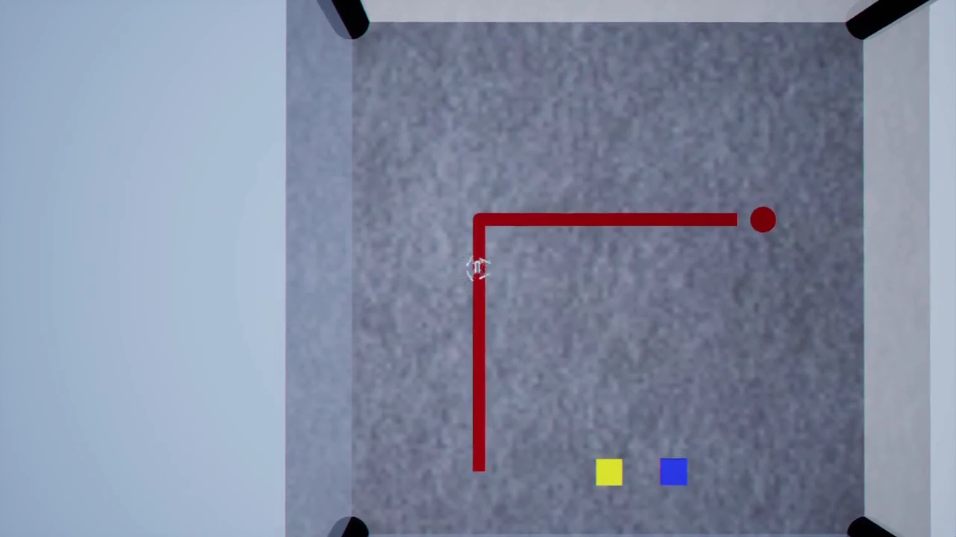 Third-person Unreal chase view of the minidrone rounding the corner of the red L-track above a grey arena floor with yellow and blue decoy squares