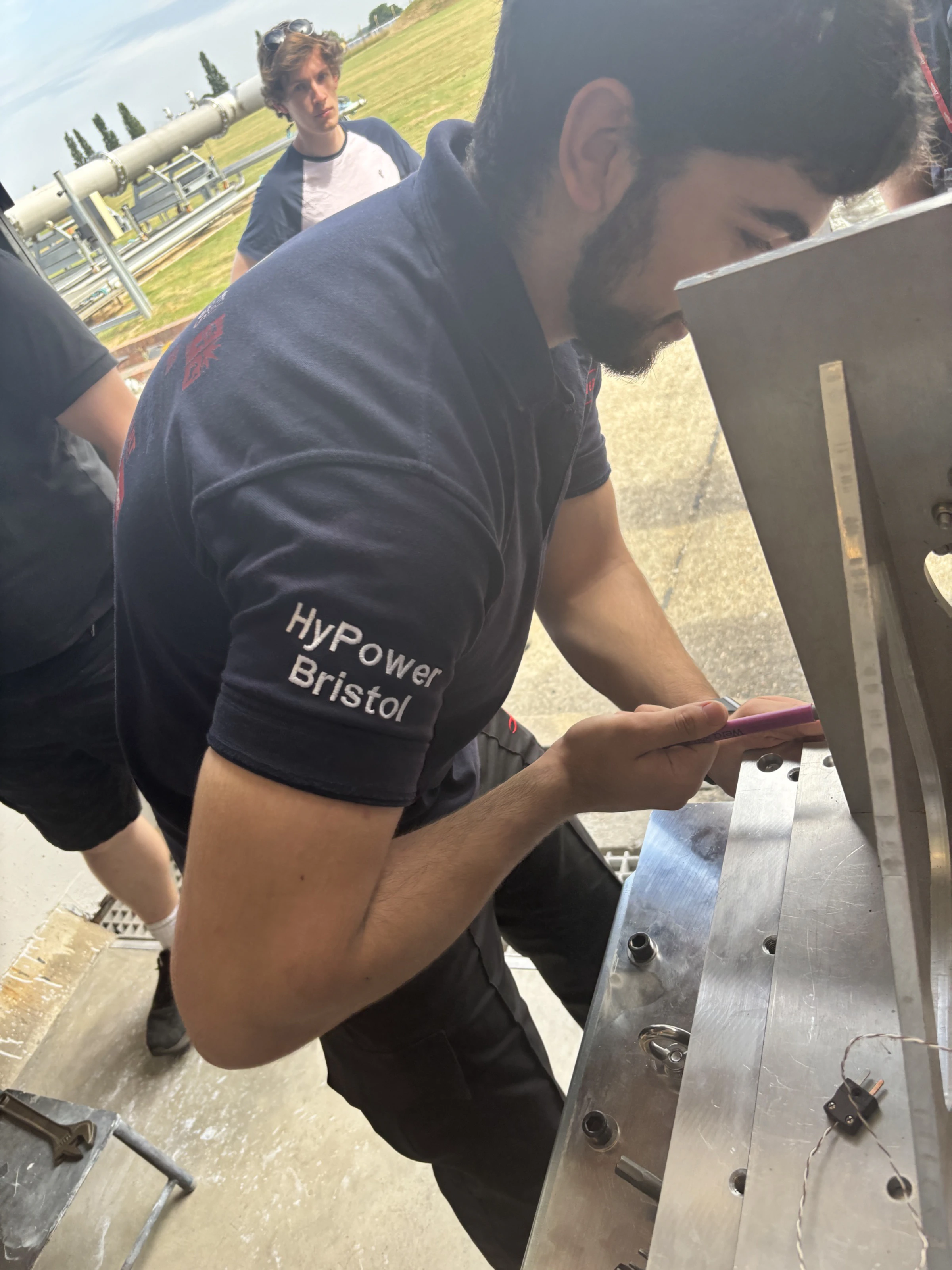 Ethan writing on the test stand during pre-fire preparation