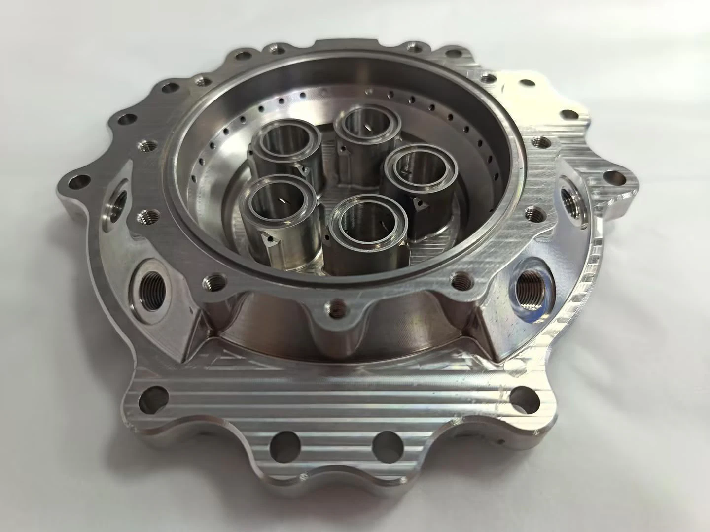 Injector body at an angle showing the depth of the element bores and the drilled ring