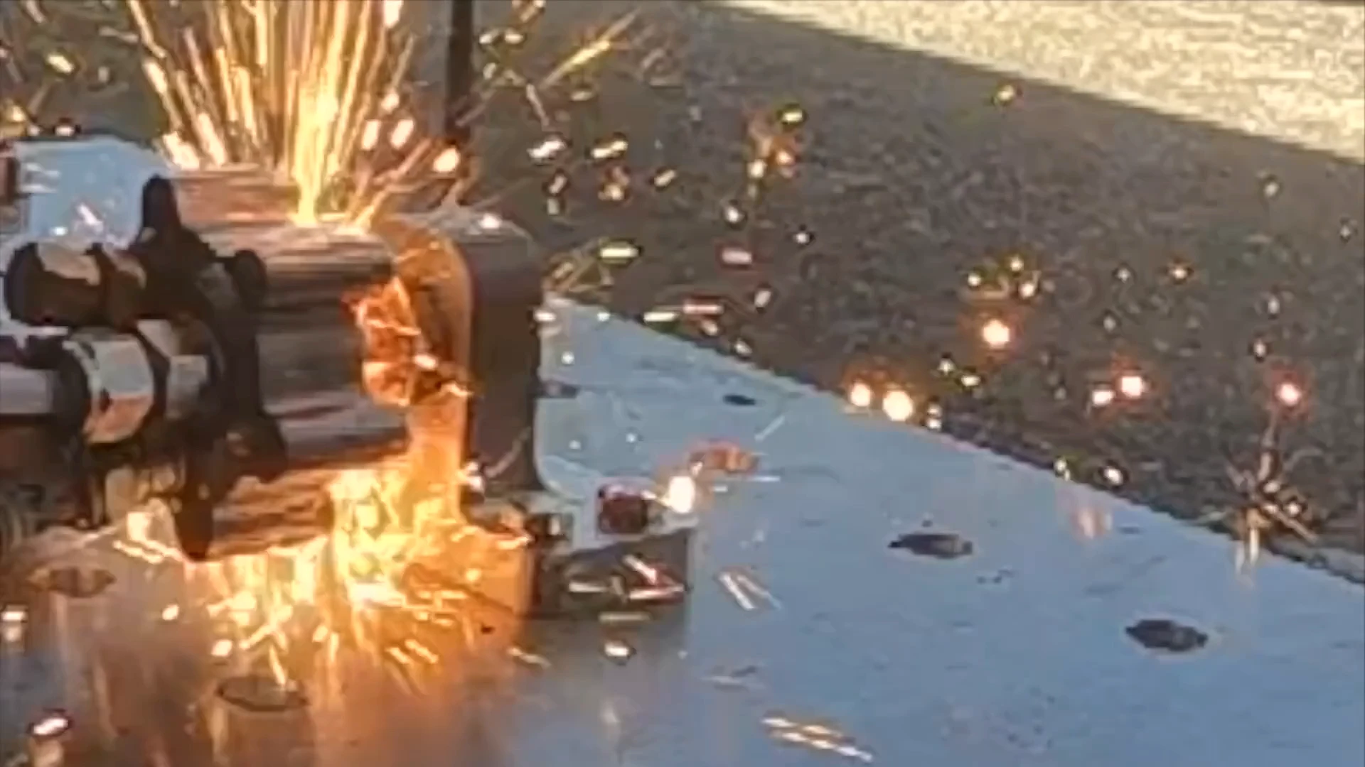 Close GoPro clip of the final burn: the igniter runs for several seconds, then flame breaks out of the body wall and a shower of sparks erupts.