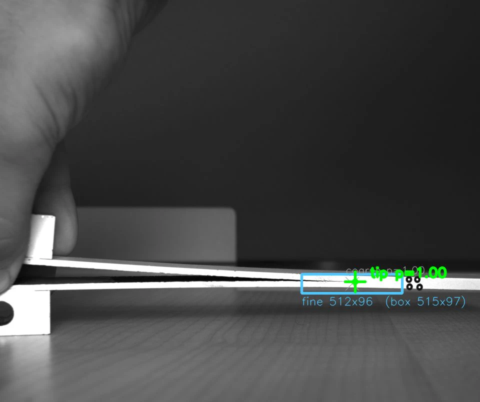 Live dashboard frame: a hand-held specimen with the fine-stage crop box and detected tip drawn in the stream