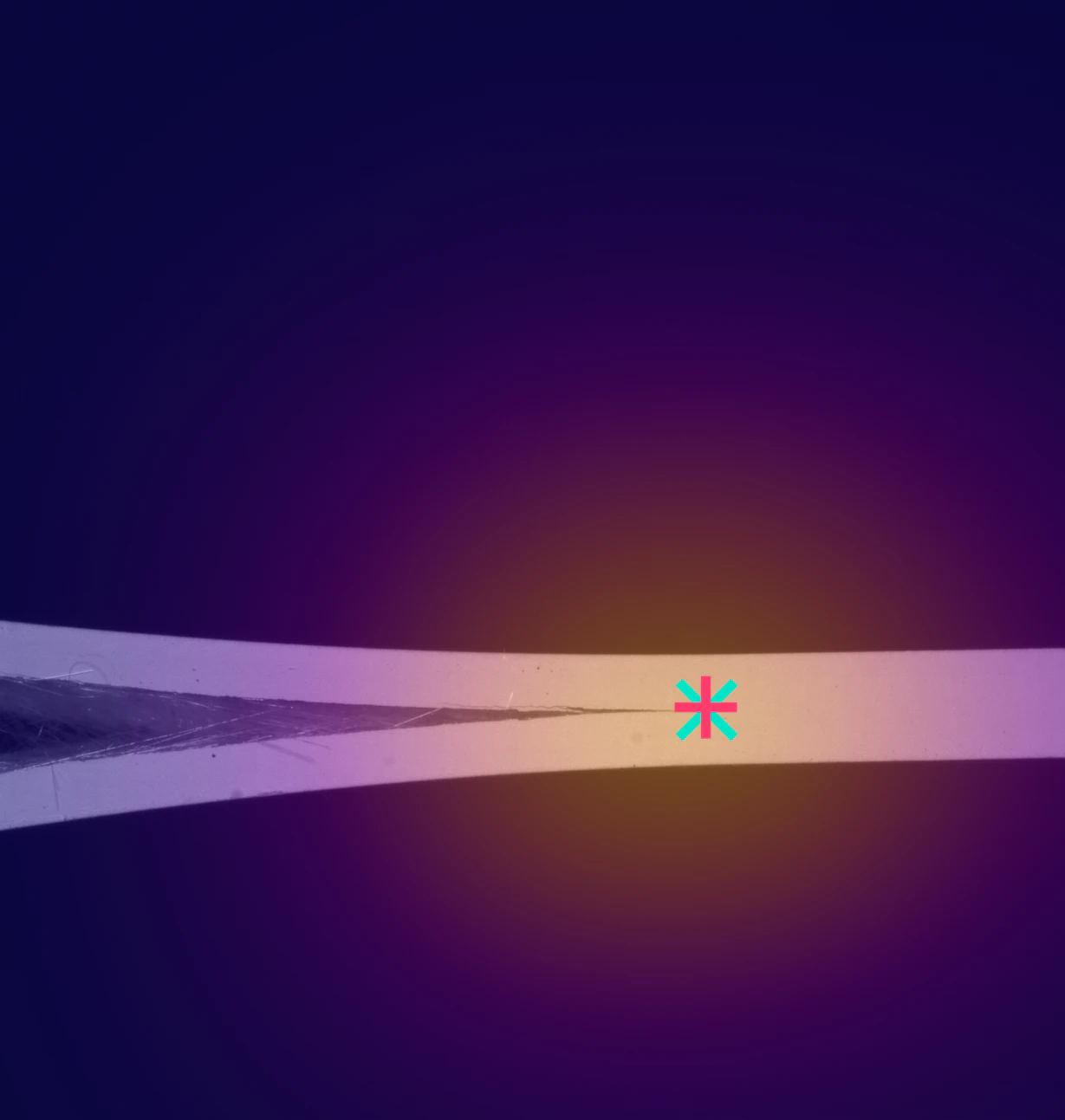 Delaminating composite specimen edge with the detected crack tip marked, on a deep purple glow